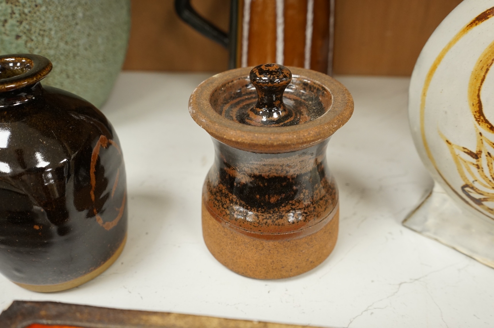 A group of eleven pieces of mixed 1960's-80's pottery to include vases, jugs and two rectangular dishes, largest 34cm high